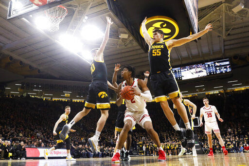 Garza, No. 18 Iowa rally to beat Wisconsin 68-62
